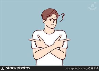 Puzzled man pointing fingers in different directions doubtful trying to accept difficult decision with unknown consequences. Puzzled guy is wondering what to make choice between two options . Puzzled man pointing fingers in different directions doubtful trying to accept difficult decision 