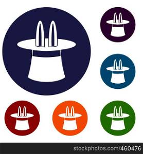 Rabbit ears appearing from a top magic hat icons set in flat circle reb, blue and green color for web. Rabbit ears appearing from a top magic hat icons