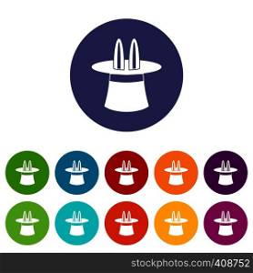 Rabbit ears appearing from a top magic hat set icons in different colors isolated on white background. Magic hat set icons