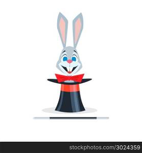 Rabbit with a red bow sits in a hat cylinder next to lies a magic wand