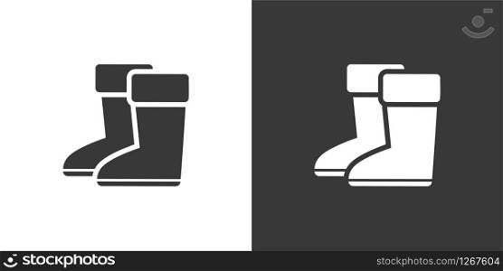 Rain boots. Isolated icon on black and white background. Winter footwear glyph vector illustration