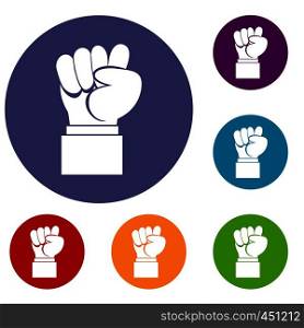 Raised up clenched male fist icons set in flat circle reb, blue and green color for web. Raised up clenched male fist icons set