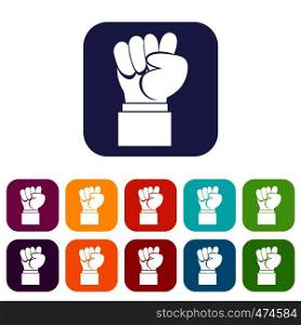 Raised up clenched male fist icons set vector illustration in flat style In colors red, blue, green and other. Raised up clenched male fist icons set