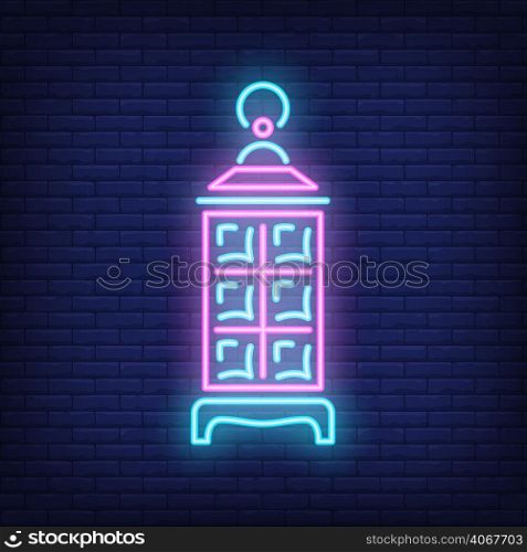 Ramadan Kareem lantern neon sign. Glowing lamp on dark brick wall background. Night bright advertisement. Vector illustration in neon style for traditional festival or Muslim holiday