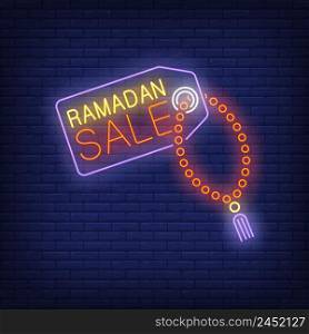 Ramadan Sale neon text on tag with prayer beads. Ramadan Kareem offer design. Night bright neon sign, colorful billboard, light banner. Vector illustration in neon style.