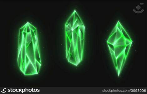 Realistic crystals set, green glowing gems collection isolated on a dark background. 3d magic stones with detailed texture.. Realistic crystals set, green glowing gems collection