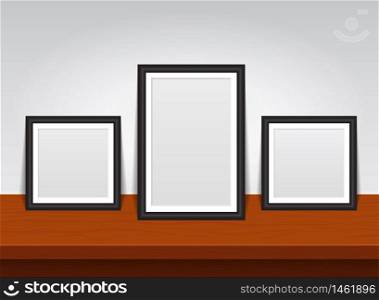 Rectangular photo frame on wooden shelf or table. 3d mockup of picture frame gallery for home interior. Empty picture album layout. Set realistic mockup picture. vector isolated illustration. Rectangular photo frame on wooden shelf or table. 3d mockup of picture frame gallery for home interior. Empty picture album layout. Set realistic mockup picture. vector isolated