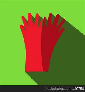 Red rubber gloves flat icon on a green background. Red rubber gloves flat