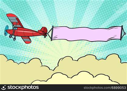 Retro airplane with a ribbon in the sky. Pop art retro vector illustration. Retro airplane with a ribbon in the sky