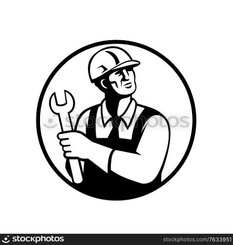 Retro black and white style illustration of a repairman or handyman holding a spanner looking up set inside circle on isolated background.. Repairman or Handyman Holding a Spanner Looking Up Circle Retro Black and White