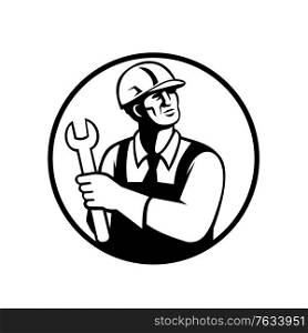 Retro black and white style illustration of a repairman or handyman holding a spanner looking up set inside circle on isolated background.. Repairman or Handyman Holding a Spanner Looking Up Circle Retro Black and White