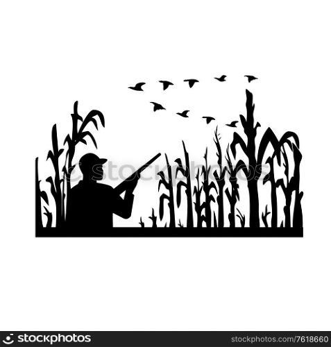Retro black and white style illustration of a silhouette duck or bird hunter with rifle in flooded cornfield with corn stalks on isolated white background.. Duck Hunter in Flooded Cornfield With Geese Flying Silhouette Retro