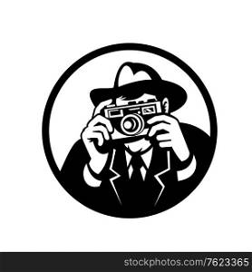 Retro style illustration of a photographer wearing fedora hat a shooting vintage camera viewed from front on isolated background in black and white.. Photographer Wearing Fedora Shooting Camera Retro Black and White