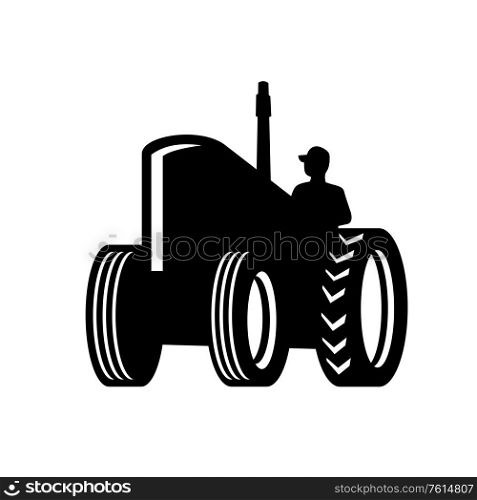 Retro style illustration of a Silhouette of a vintage Farm Tractor viewed from a low angle on isolated white background done in retro black and white style.. Vintage Farm Tractor Silhouette Retro Black and White