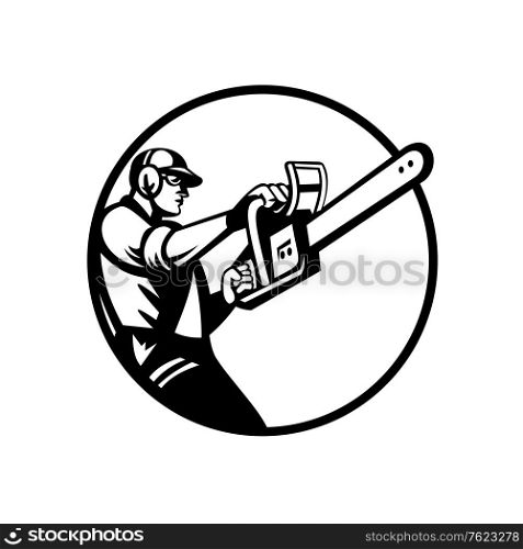 Retro style illustration of an arborist, lumberjack or tree surgeon holding and raising up chainsaw viewed from side set inside circle on isolated background in black and white. . Arborist or Tree Surgeon Holding Chainsaw Side View Circle Retro Black and White