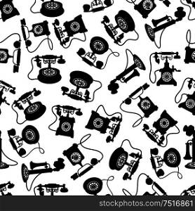 Retro telephones seamless pattern with black silhouettes of rotary dial and candlestick phones with magneto handles and decorative handsets over white background. Vintage rotary dial telephones pattern
