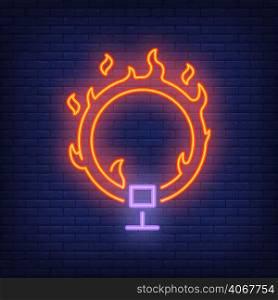 Ring on fire neon icon. Circus flaming hoop on dark brick wall background. Night bright advertisement. Vector illustration in neon style for circus performance or dangerous trick