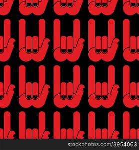 Rock hand sign seamless pattern. Black background and red hands. Rock and roll Textur. &#xA;