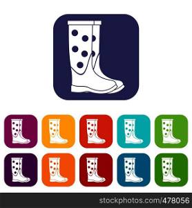 Rubber boots icons set vector illustration in flat style in colors red, blue, green, and other. Rubber boots icons set