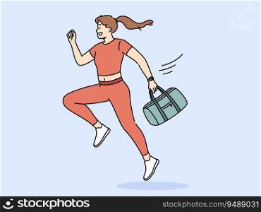 Running woman in sportswear holds bag with fitness items in hand and rushes to workout. Girl in sports uniform runs to fitness club, wanting to get rid of excess weight as soon as possible.. Running woman in sportswear holds bag with fitness items in hand and rushes to workout