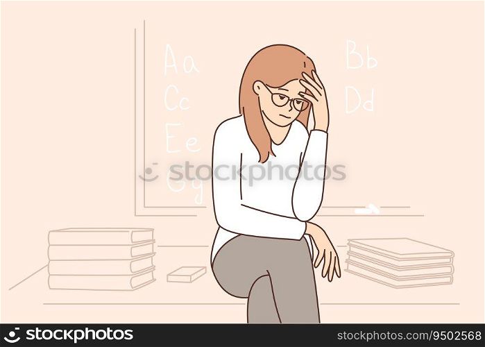 Sad girl student sits near blackboard and gets upset because of lack of prospects after receiving education. Teenage high school student suffers from melancholy and needs help of child psychologist. Sad girl sits near blackboard and gets upset because of lack of prospects after receiving education