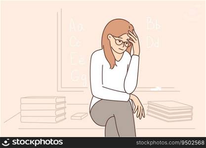 Sad girl student sits near blackboard and gets upset because of lack of prospects after receiving education. Teenage high school student suffers from melancholy and needs help of child psychologist. Sad girl sits near blackboard and gets upset because of lack of prospects after receiving education