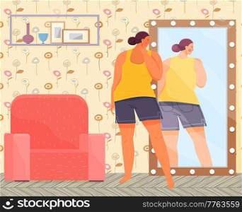 Sad overweight woman in sportswear looking at reflection in mirror. Unhappy young plump girl in home pajama standing in front of mirror looks at herself from back. Obese girl over size obesity concept. Woman in sportswear looking at reflection in mirror. Unhappy plump girl standing in front of mirror