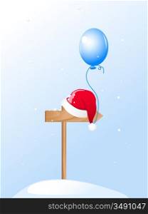 Santa&acute;s Hat and blue balloon on a wooden pointer