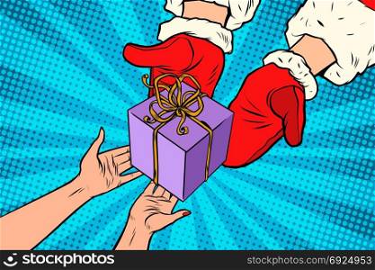 Santa Claus gives Christmas gift. Pop art retro vector illustration. Santa Claus gives Christmas gift