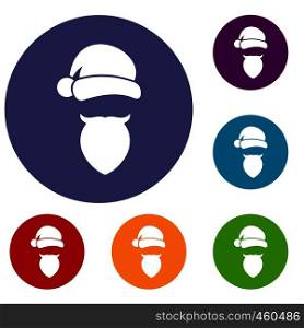 Santa Claus hat and beard icons set in flat circle reb, blue and green color for web. Santa Claus hat and beard icons set