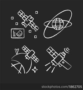 Satellites in space chalk white icons set on dark background. Science spacecraft location, positioning in space. Satellite orbits, trajectories. Isolated vector chalkboard illustrations on black. Satellites in space chalk white icons set on dark background