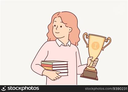Schoolgirl with trophy cup and books in hands rejoices in victory in olympiad for outstanding elementary school students. Little girl with gold ch&ion cup for smartest kids from gymnasium. Schoolgirl with trophy gold cup and books in hands rejoices in victory in school olympiad