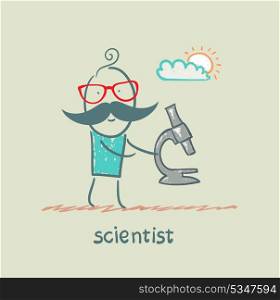 Scientist holding microscope