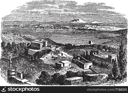 Sea of Galilee or Lake of Gennesaret or Kinneret or Lake Tiberias, in Israel, during the 1890s, vintage engraving. Old engraved illustration of Sea of Galilee with buildings in front.
