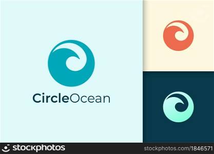 Sea or ocean logo in simple circle shape represent beach or surfing