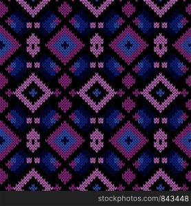 Seamless knitting geometrical vector pattern in blue, pink and black colors as a knitted fabric texture