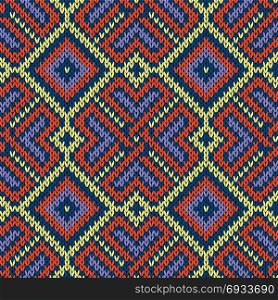 Seamless ornamental knitted vector pattern mainly in blue, and yellow hues as a fabric texture