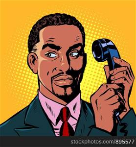 serious african man talking on a retro phone. Pop art retro vector illustration drawing. serious african man talking on a retro phone