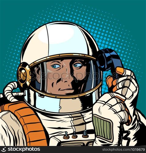 serious astronaut talking on a retro phone. Pop art retro vector illustration drawing. serious astronaut talking on a retro phone