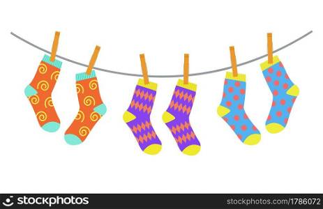 Set of colorful bright children socks drying on the clothesline. Vector illustration in flat style.. Set of colorful bright children socks drying on the clothesline. Vector illustration in flat style