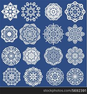 Set of Decorative paper snowflakes. White on blue background