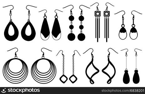 Set of different earrings isolated on white