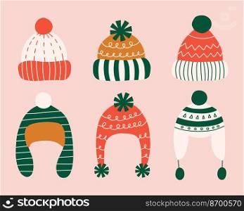 Set of different hand drawn winter hats with pompoms in flat style. Vector illustration.