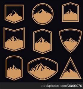 Set of empty badges with mountains in golden style. Design elements for logo, label, emblem, sign. Vector illustration