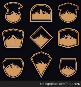 Set of empty badges with mountains in golden style. Design elements for logo, label, emblem, sign. Vector illustration