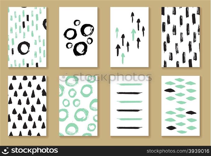 Set of greeting or business card templates in black, white and mint colors. Ink painted hand drawn cards