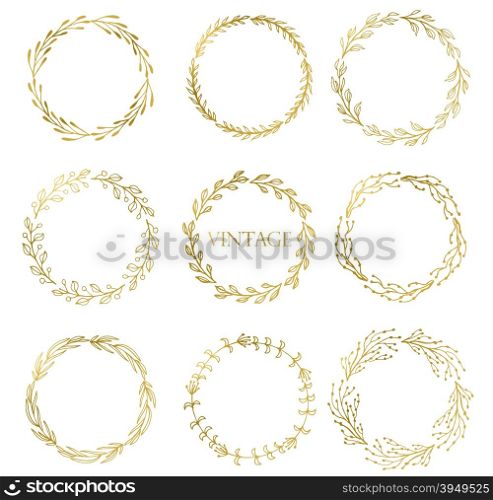 Set of Handdrawn ink painted gold floral wreaths and laurels. Vintage vector golden elements for wedding, holiday and greeting cards, web, prind scrapbooking design and other