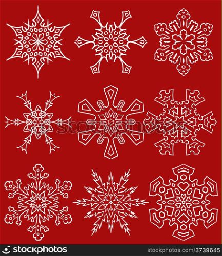 Set of nine beautiful drawn snowflake silhouettes