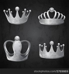 Set of old silver crowns isolated.