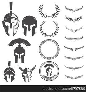 Set of the spartan warriors helmets and design elements for emblems create. Design elements for logo, label, emblem, sign. Vector illustration.